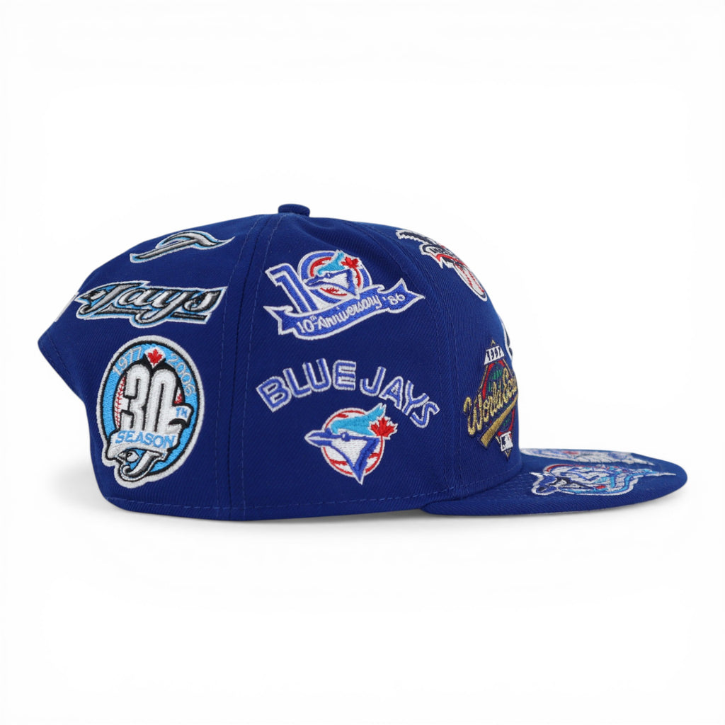 GORRA NEW ERA SNAPBACK 950 ALL OVER BLUE JAYS