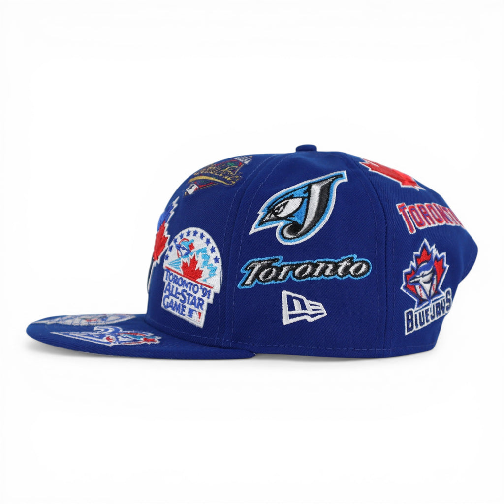 GORRA NEW ERA SNAPBACK 950 ALL OVER BLUE JAYS
