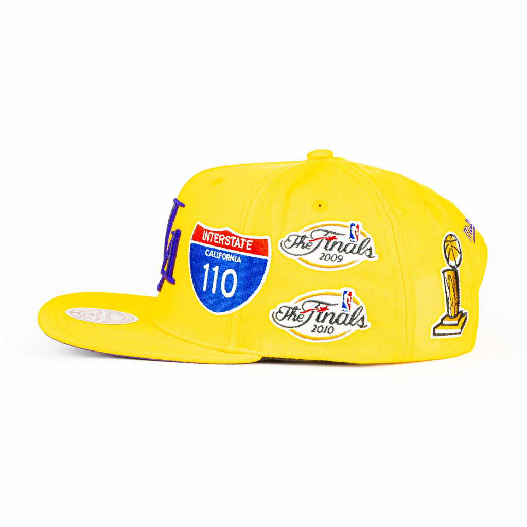 Gorra Mitchell&Ness LAKERS CHAMP PATCH GOLD | Snapback Visera Plana